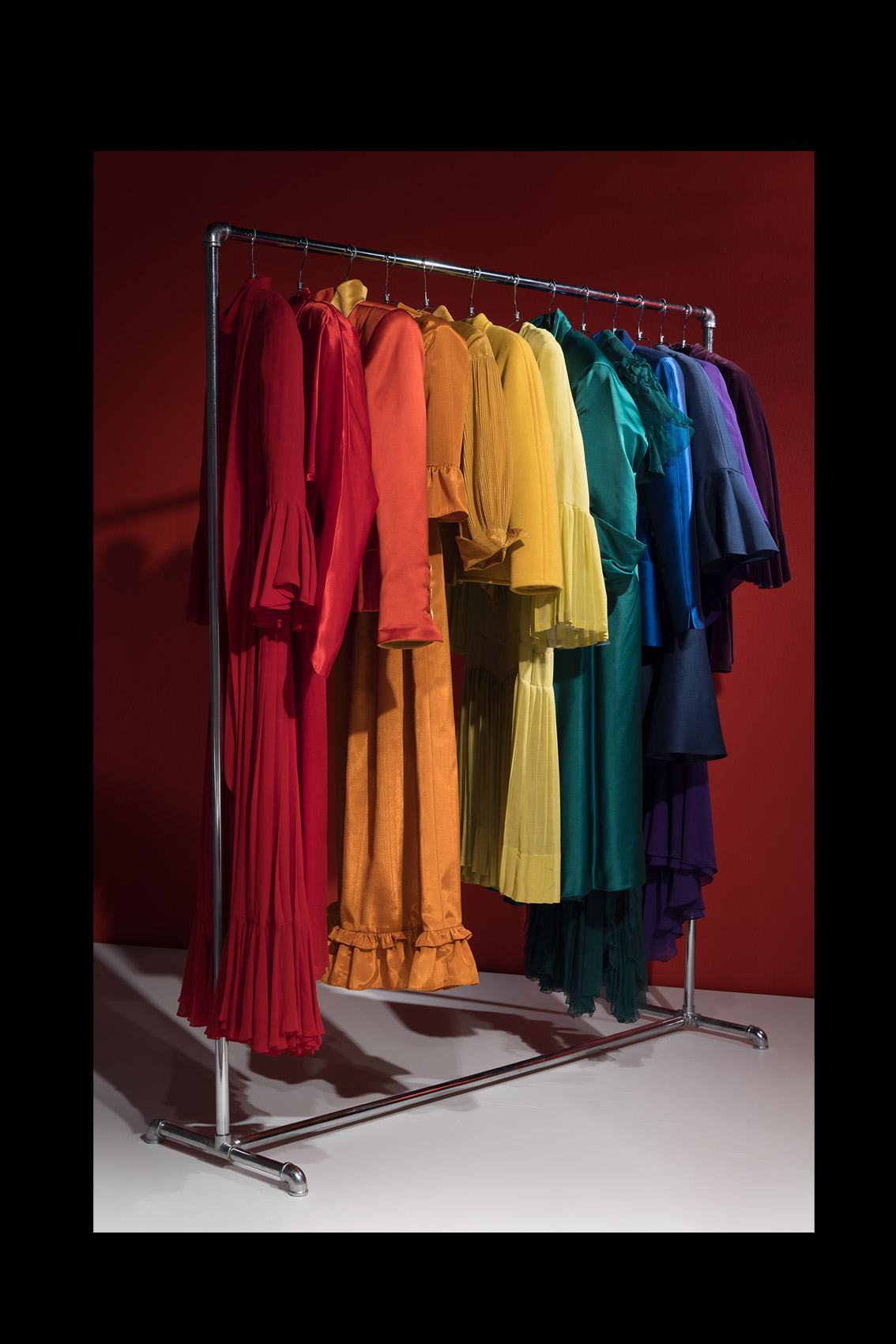 rack of rainbow-colored garments